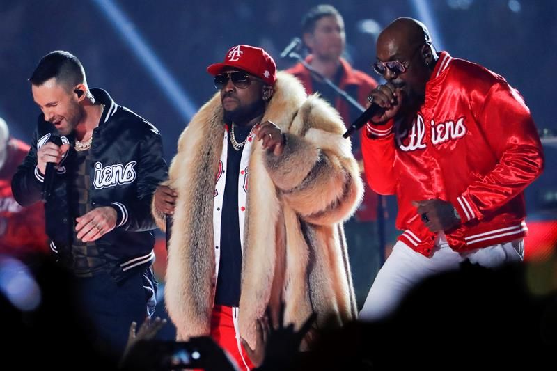 Rapper Big Boi (C), Maroon 5's Adam Levine (L) and Sleepy Brown (R) perform during the half time show of Super Bowl LIII 