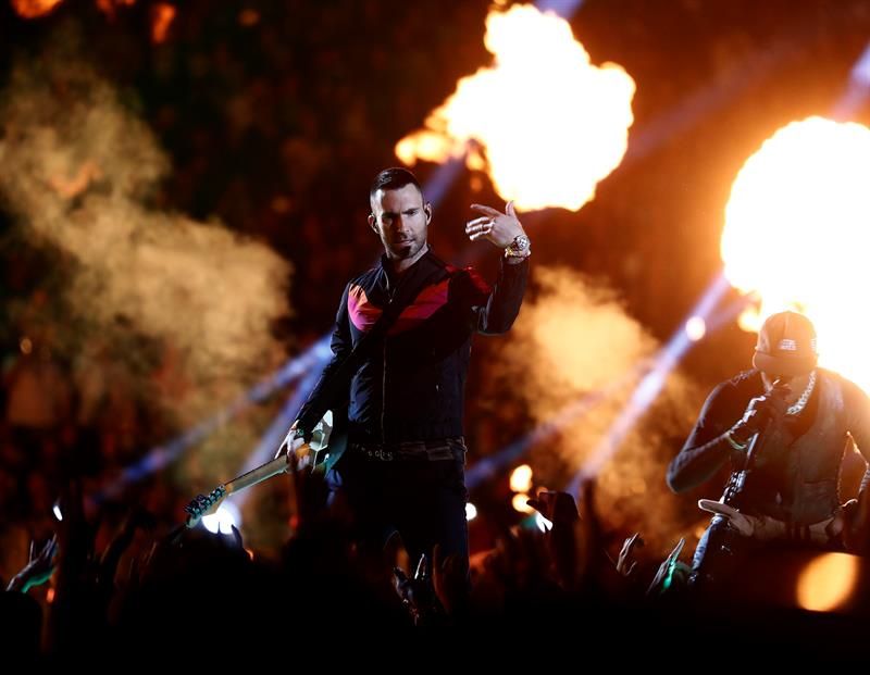 Adam Levine (L) of Maroon 5 and Travis Scott (R) perform during the halftime show of Super Bowl LIII 