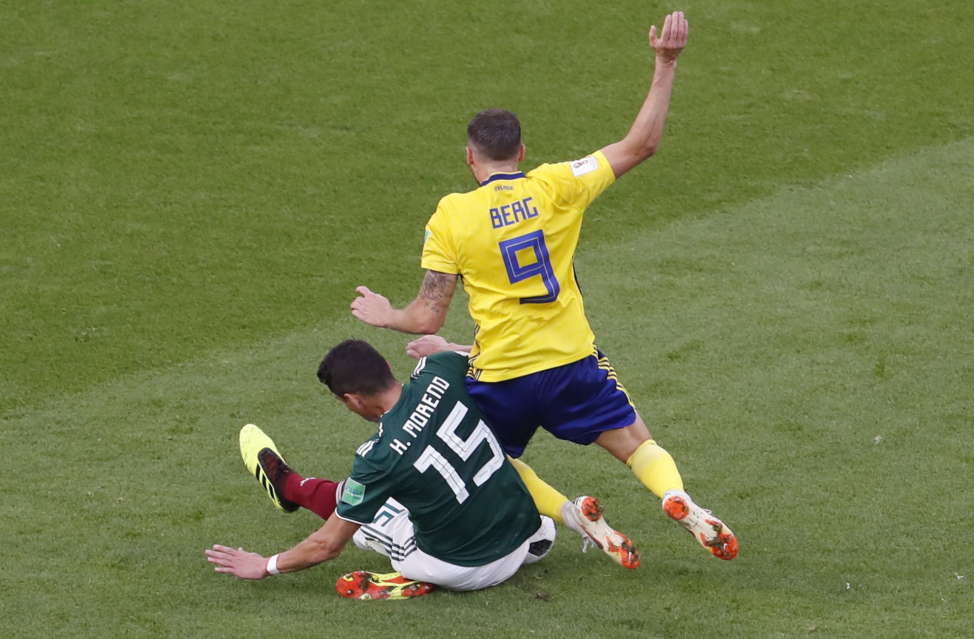 Hector Moreno (L) of Mexico fouls Marcus Berg of Sweden during the FIFA World Cup 2018 group F preliminary round soccer match between Mexico and Sweden in Ekaterinburg, Russia, 27 June 2018.